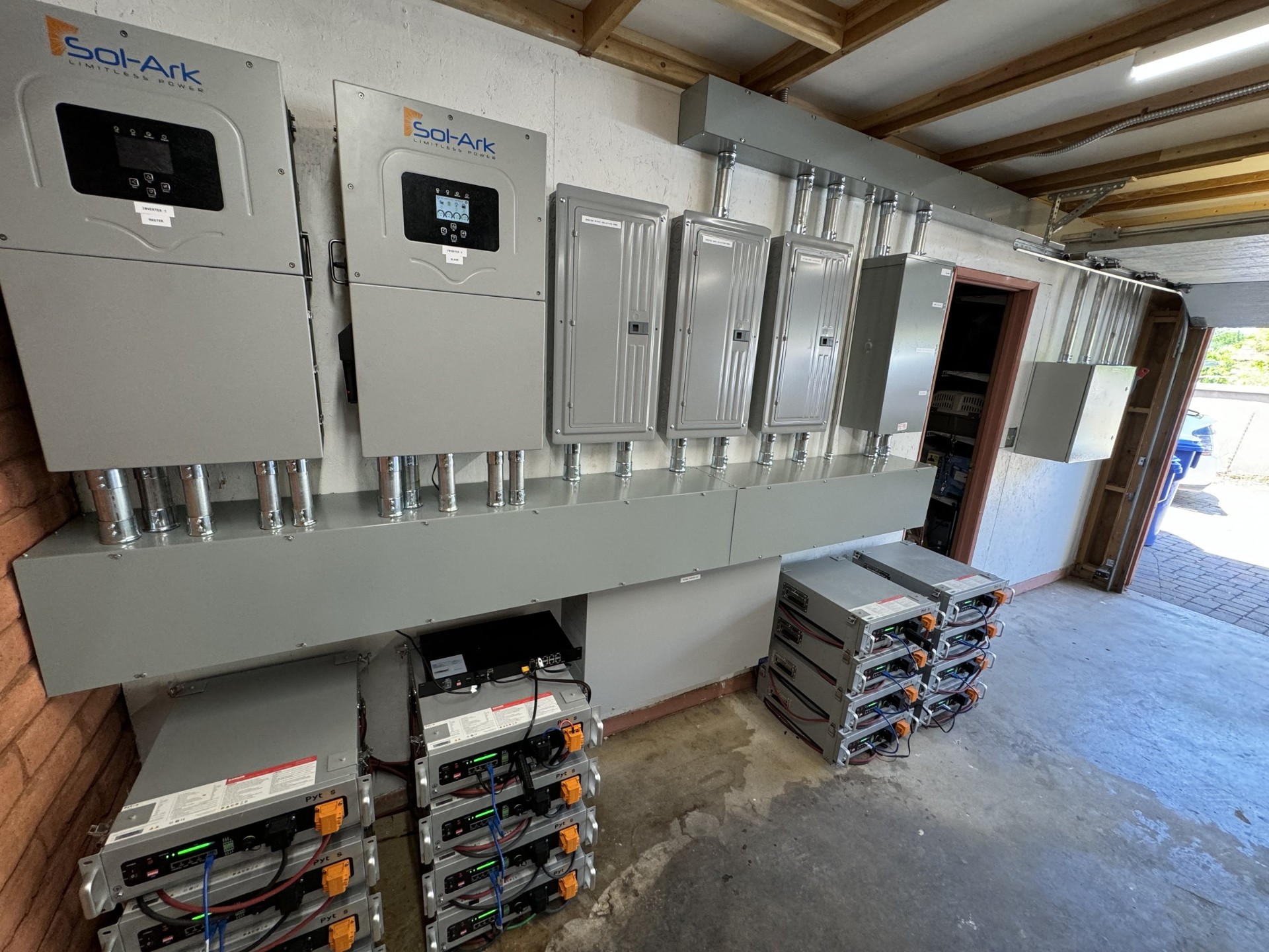 Rebuilt off-grid power room with Sol-Ark inverters and battery banks